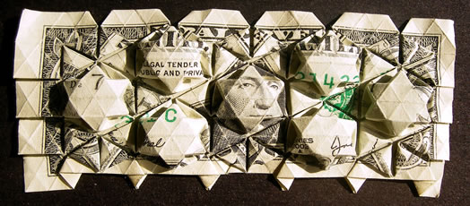 Billete de un dolar doblado, trabajo de papiroflexia de Eric Gjerde. Enlace a la página de diseño